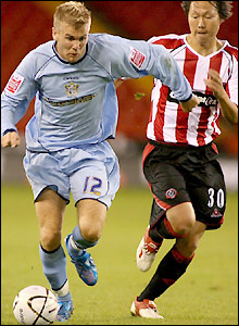 Andy Bishop in action for Bury.