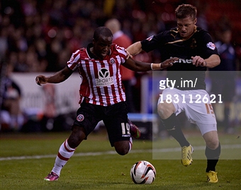 Febian Brandy and Crawley's Dannie Bulman battle for the ball in the 1-1 draw at Bramall Lane in October 2013.