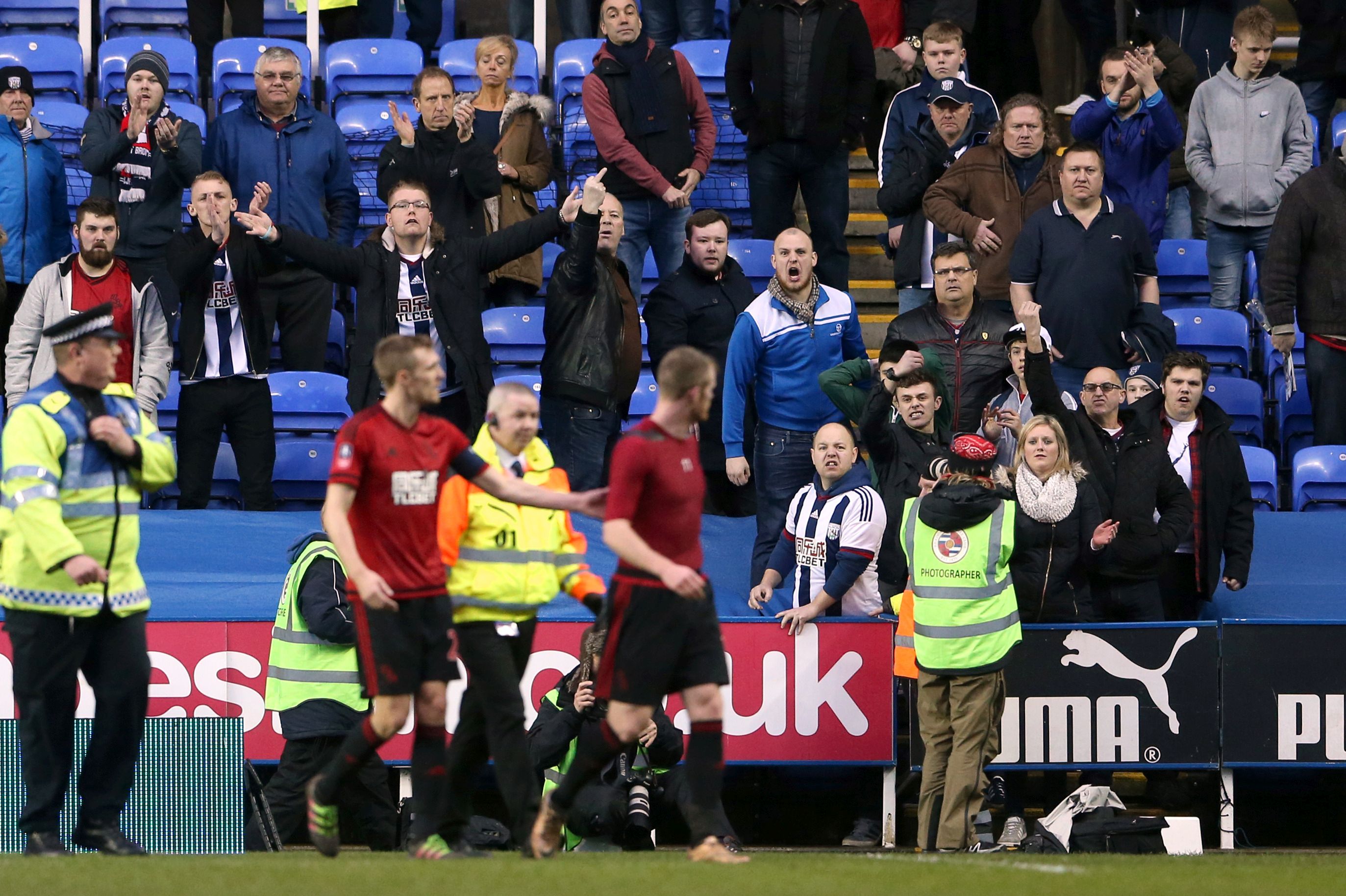 Picture by: Scott Heavey / PA Wire/Press Association Images  West Bromwich Albion fans voice their anger towards Chris Brunt (centre) and Darren Fletcher after the final whistle, during the Emirates FA Cup, fifth round match at the Madejski Stadium, Reading.